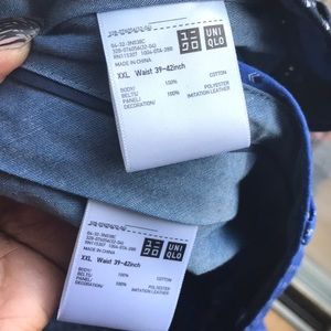 Two Uniqlo men's shorts with belts.